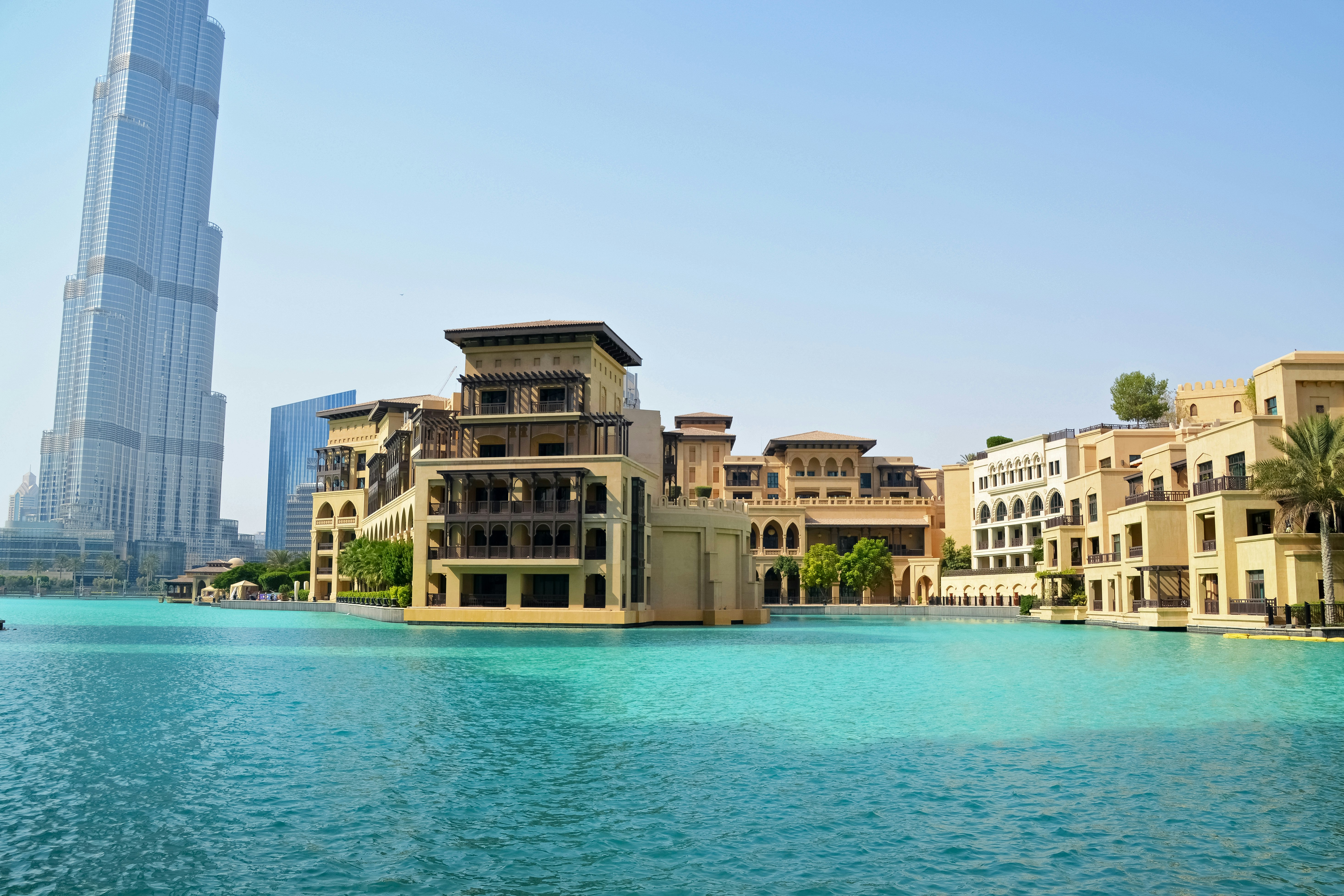 brown concrete building near body of water during daytime